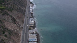 CAP_018_059 - HD stock footage aerial video of oceanfront homes by PCH at sunset, Malibu, California
