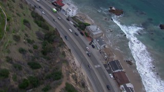 CAP_018_061 - HD stock footage aerial video of light traffic on PCH at sunset and Malibu homes, California