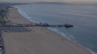 CAP_018_065 - HD stock footage aerial video of flying over the beach toward Santa Monica Pier at sunset, California