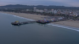 CAP_018_068 - HD stock footage aerial video orbit Santa Monica Pier and Ferris wheel at sunset, California