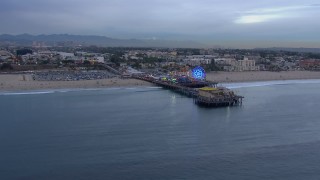 CAP_018_069 - HD stock footage aerial video orbit the end of Santa Monica Pier and Ferris wheel at sunset, California