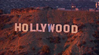 CAP_018_084 - HD stock footage aerial video of a close-up view of the famous Hollywood Sign at sunset, California