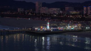 CAP_018_108 - HD stock footage aerial video of orbiting Santa Monica Pier and Ferris wheel at twilight, California