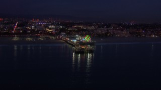 CAP_018_109 - HD stock footage aerial video of flying toward Santa Monica Pier and Ferris wheel at twilight, California