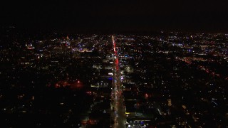 CAP_018_136 - HD stock footage aerial video of following Sunset Blvd through Hollywood at night, California