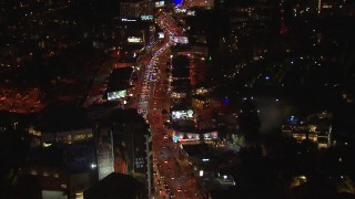 CAP_018_141 - HD stock footage aerial video fly above Sunset Strip billboards and traffic at night in West Hollywood, California