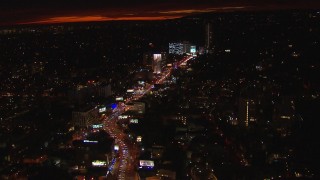 CAP_018_142 - HD stock footage aerial video tilt for a view of Sunset Strip billboards and traffic at night in West Hollywood, California