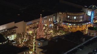 CAP_018_148 - HD stock footage aerial video of circling a Christmas tree at The Grove shopping mall at night in Los Angeles, California