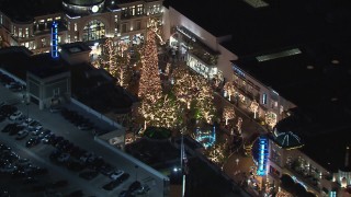 CAP_018_154 - HD stock footage aerial video of orbiting The Grove shopping mall, decorated for the holidays, at night in Los Angeles, California
