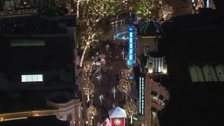 CAP_018_161 - HD stock footage aerial video of holiday decorations and fountain at The Grove shopping mall at night in Los Angeles, California