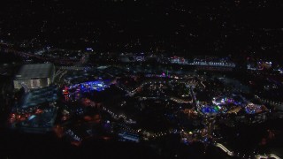 CAP_018_169 - HD stock footage aerial video of flying around the Universal Studios Hollywood theme park at night, Universal City, California