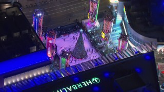 CAP_018_191 - HD stock footage aerial video of orbiting an ice skating rink at night, Downtown Los Angeles, California