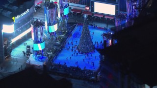 CAP_018_192 - HD stock footage aerial video of an ice skating rink and Christmas tree at night, Downtown Los Angeles, California