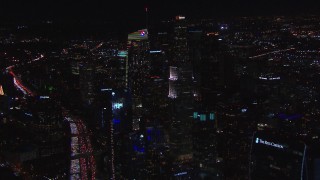 CAP_018_200 - HD stock footage aerial video of approaching Wilshire Grand Center at night, Downtown Los Angeles, California