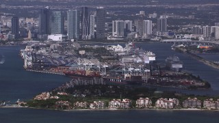 CAP_020_027 - HD stock footage aerial video of a view of Fisher Island, Port of Miami and downtown skyline, Florida
