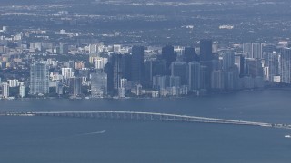 CAP_020_043 - HD stock footage aerial video of a wide view of the city's skyline behind the Rickenbacker Causeway, Miami, Florida