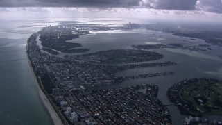 CAP_020_059 - HD stock footage aerial video of flying over Miami Beach toward Biscayne Bay and Downtown Miami, Florida