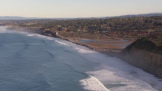 CAP_021_003 - HD stock footage aerial video of flying by lagoon toward hillside homes in Del Mar, California