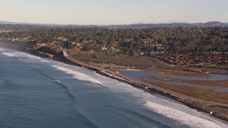 CAP_021_004 - HD stock footage aerial video of Torrey Pines Road and hillside homes in Del Mar, California