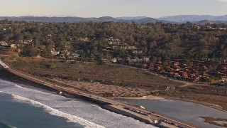 CAP_021_005 - HD stock footage aerial video of flying by hillside homes by Torrey Pines Road in Del Mar, California