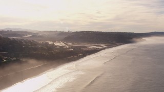CAP_021_006 - HD stock footage aerial video of flying away from coastal cliffs, lagoon, and hillside homes in Torrey Pines and Del Mar, California