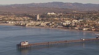 CAP_021_023 - HD stock footage aerial video of orbit Oceanside Pier with view of the community of Oceanside, California