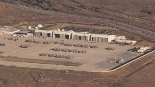 CAP_021_028 - HD stock footage aerial video of military craft and hangars at Camp Pendleton South, California