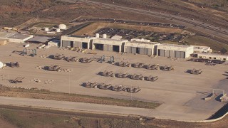 CAP_021_029 - HD stock footage aerial video of slowly passing military craft and hangars at Camp Pendleton South, California