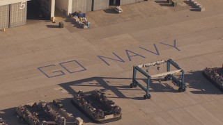 CAP_021_032 - HD stock footage aerial video of "Go Navy" by military craft at Camp Pendleton South, California