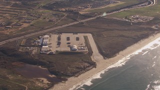 CAP_021_035 - HD stock footage aerial video of a reverse view of military craft at Camp Pendleton South, California