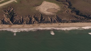 CAP_021_036 - HD stock footage aerial video of an empty strip of beach and cliffs on the coast, Oceanside, California
