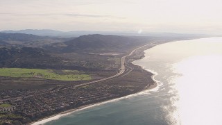 CAP_021_055 - HD stock footage aerial video of a reverse view of I-5 by coastal neighborhoods in San Clemente, California