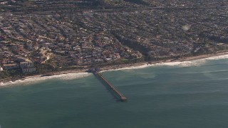 CAP_021_057 - HD stock footage aerial video of flying away from a pier by coastal neighborhoods in San Clemente, California