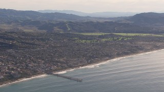 CAP_021_058 - HD stock footage aerial video of a wide view of a pier by coastal neighborhoods in San Clemente, California
