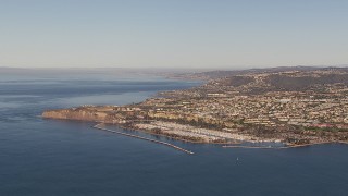 CAP_021_059 - HD stock footage aerial video of approaching the harbor and coastal neighborhoods in Dana Point, California