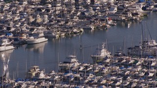 CAP_021_063 - HD stock footage aerial video of flying away from yachts and sailboats at the harbor in Dana Point, California