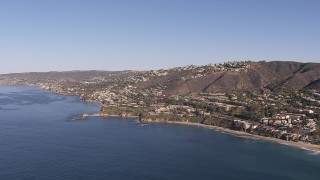 CAP_021_067 - HD stock footage aerial video approach hillside homes and coastal neighborhoods in Laguna Beach, California