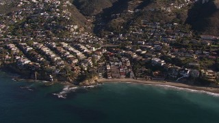 CAP_021_069 - HD stock footage aerial video flying by beach and oceanfront mansions in Laguna Beach, California