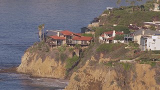 CAP_021_071 - HD stock footage aerial video of an oceanfront mansion on a cliff in Laguna Beach, California
