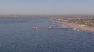 CAP_021_080 - HD stock footage aerial video of approaching a diner on a pier, Huntington Beach, California