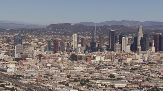 CAP_021_090 - HD stock footage aerial video of flying toward the city's skyline and Hollywood Sign, Downtown Los Angeles, California