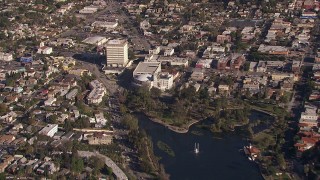 CAP_021_111 - HD stock footage aerial video of tilting from lake to reveal an office building in Echo Park, Los Angeles, California