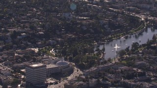 CAP_021_115 - HD stock footage aerial video of flying away from an office building, reveal lake in Echo Park, Los Angeles, California