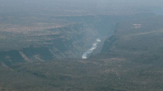 CAP_026_006 - HD stock footage aerial video of passing by a river in a deep canyon near Victoria Falls, Zimbabwe