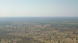 CAP_026_010 - HD stock footage aerial video of a wide view across open savanna, Zimbabwe