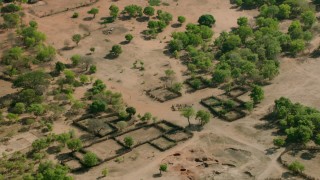 CAP_026_015 - HD stock footage aerial video orbiting a village in open savanna, Zimbabwe