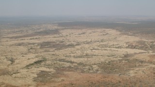 CAP_026_018 - HD stock footage aerial video of flying by open savanna, Zimbabwe