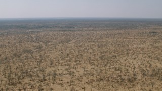 CAP_026_035 - HD stock footage aerial video of flying over a wide expanse of savanna, Zimbabwe