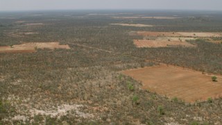 CAP_026_064 - HD stock footage aerial video of panning across the savanna to reveal fields, Zimbabwe