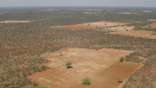 CAP_026_065 - HD stock footage aerial video of flying by fields in the savanna, Zimbabwe